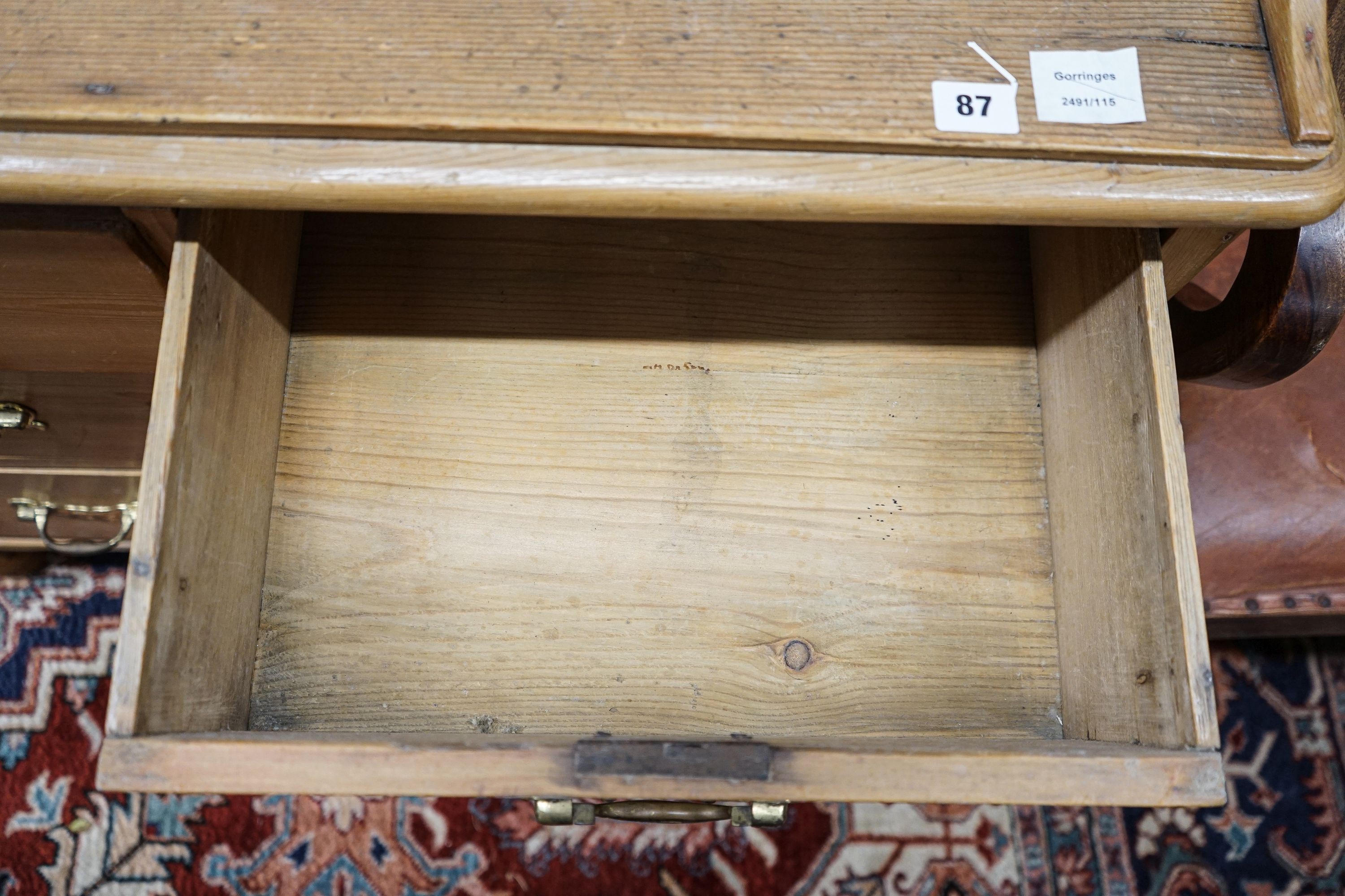 A Victorian pine chest, with three quarter gallery, four drawers and turned feet, width 96cm, depth 44cm, height 99cm